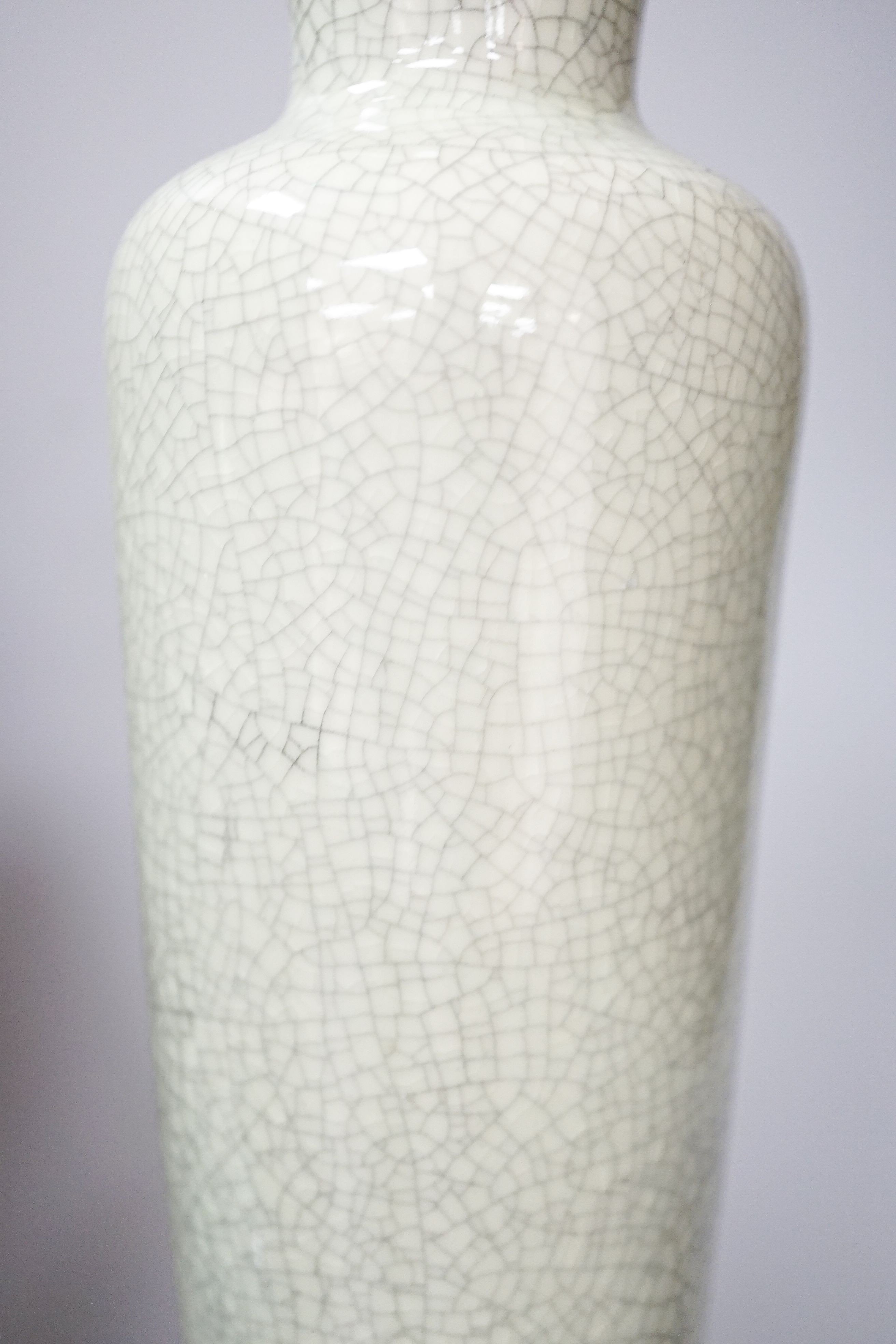 Two Chinese blue and white vases and a slender crackle glaze vase, Qing and later 30cm